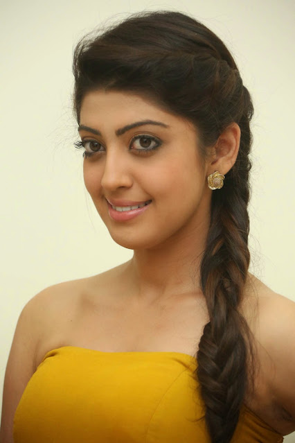 Pranitha Subhash looking adorable in a yellow sleeveless dress.