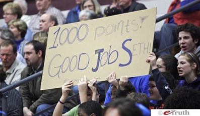 Bethany fans hold a sign congratulating Seth Kauffman on his 1,000th point in this Feb. 17 photo. (Jay Seawell/Elkhart Truth)