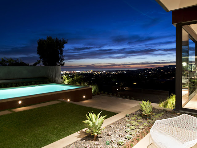 Photo of Los Angeles city lights as seen from the backyard of luxury modern house