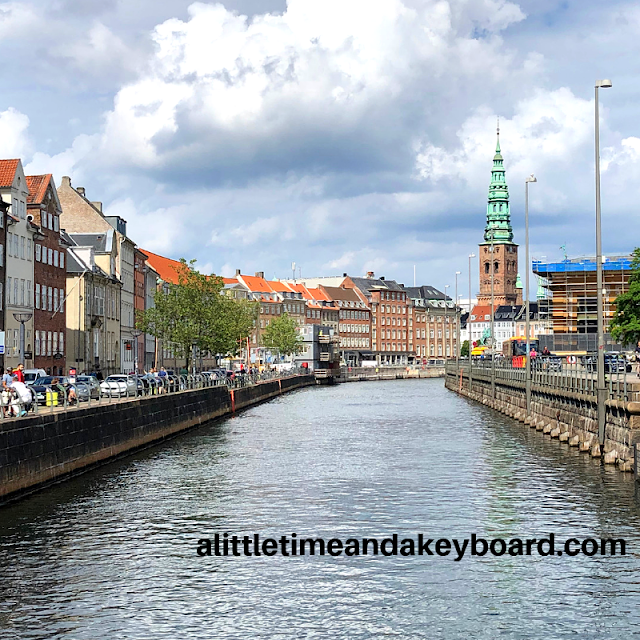 Enjoying the canals of Copenhagen on a summer day soaking in lovely historic buildings.