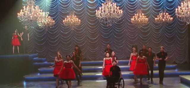 The season 3 glee kids in their red and black Nationals outfits on stage