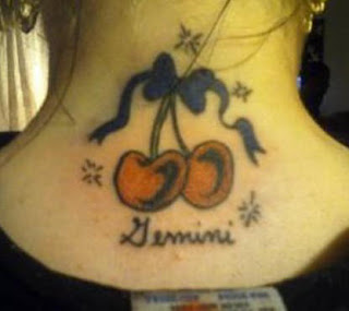 Bow and Cherry Tattoo on back of Neck