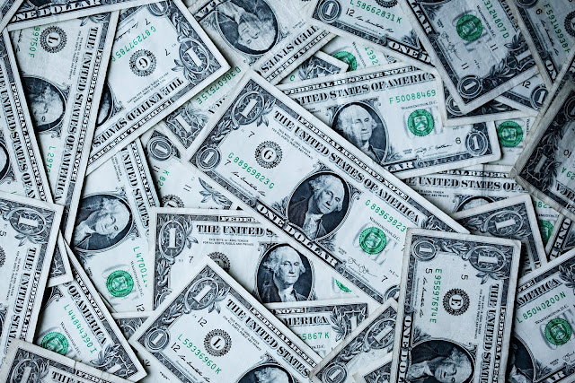 Collection of US Dollar Bills | Photo by Sharon McCutcheon via Unsplash