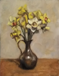 Oil painting of a variety of daffodils in a pewter jug.