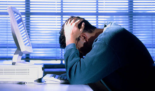 a stressed man due to computer