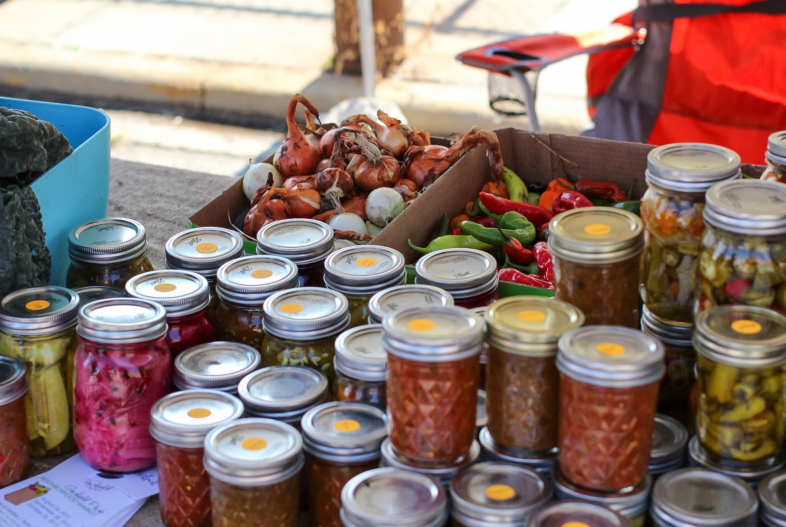 and vendors selling pickled relishes, salsas, and fresh produce.