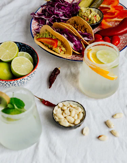 Mockingbird_alcohol_free_tequilas_upon_table_with_mediteranean_ dish_limes_and_almonds