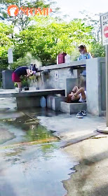 Stomper K show a woman washing her hair at a sink and another woman lying down nearby, with a pair of shoes next to her.