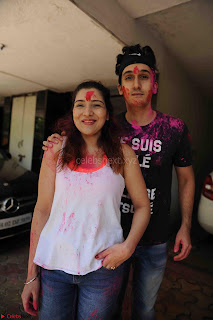 Govinda celeting Holi with His family wife daughter 002.JPG