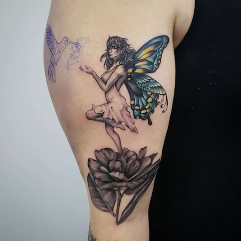 Fairy-sitting-on-rose-tattoo