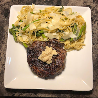 Grilled prime ribcap with linguine tossed with garlic, olive oil, broccoli rabe and asparagus topped with shaved parmesan