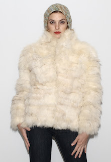 Vintage 1970's fluffy long sleeved white arctic fox fur coat.