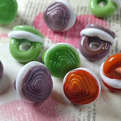 Stepped heart glass shank button beads