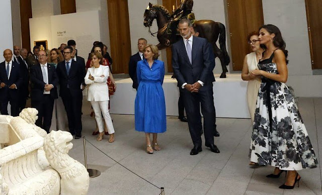 Queen Letizia wore a new floral bow a-line cocktail dress by Carolina Herrera. King Felipe and Prime Minister Pedro Sanchez