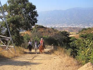 Horseback riders approaching Vista Del Valle Drive, Griffith Park