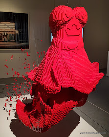 Art Of The Brick LEGO model red dress exploding and ripping apart