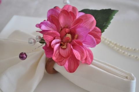 It's made of silk flower on wooden ring and I added some pearl beads on 