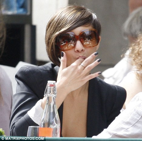 Yummy The Saturdays singer Frankie Sandford licks her fingers after eating