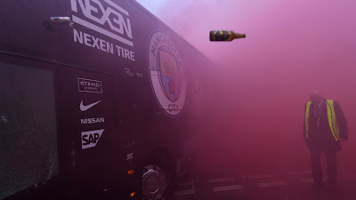 TUESDAY Liverpool fans had gathered around the Arkles pub on Anfield Road to greet their own team bus prior to kick-off. It turned hostile for the Citizens whose team bus was pelleted with eggs, flares, cans and glass bottles by Liverpool fans. It had its windows smashed - another bus had to be arranged to take players and staff back to Manchester.    UEFA  is now investigating the incidence and charges will be brought against anybody found guilty of the disturbing occurrence.