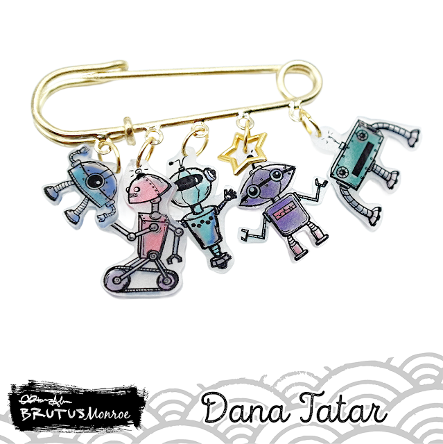 Dana Tatar creates a whimsical charm pin using the Best Bots Stamp Set, which features robots from outer space, and shrink plastic for Brutus Monroe.