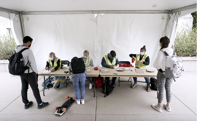 At the University of Wisconsin-Madison, students have signed up as poll workers to help fellow students navigate some of the nation’s toughest voter ID laws.Credit...Steve Apps/Wisconsin State Journal, via Associated Press