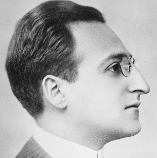 Man with a sloping facial profile and heavy nose. Louis Untermeyer, American poet.