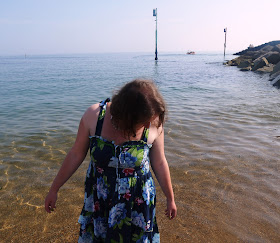 Girl in Dress Paddling in the Sea