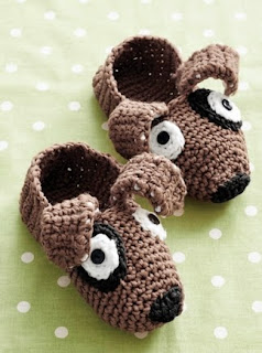 http://www.yarnspirations.com/pattern/knitting/puppy-slippers