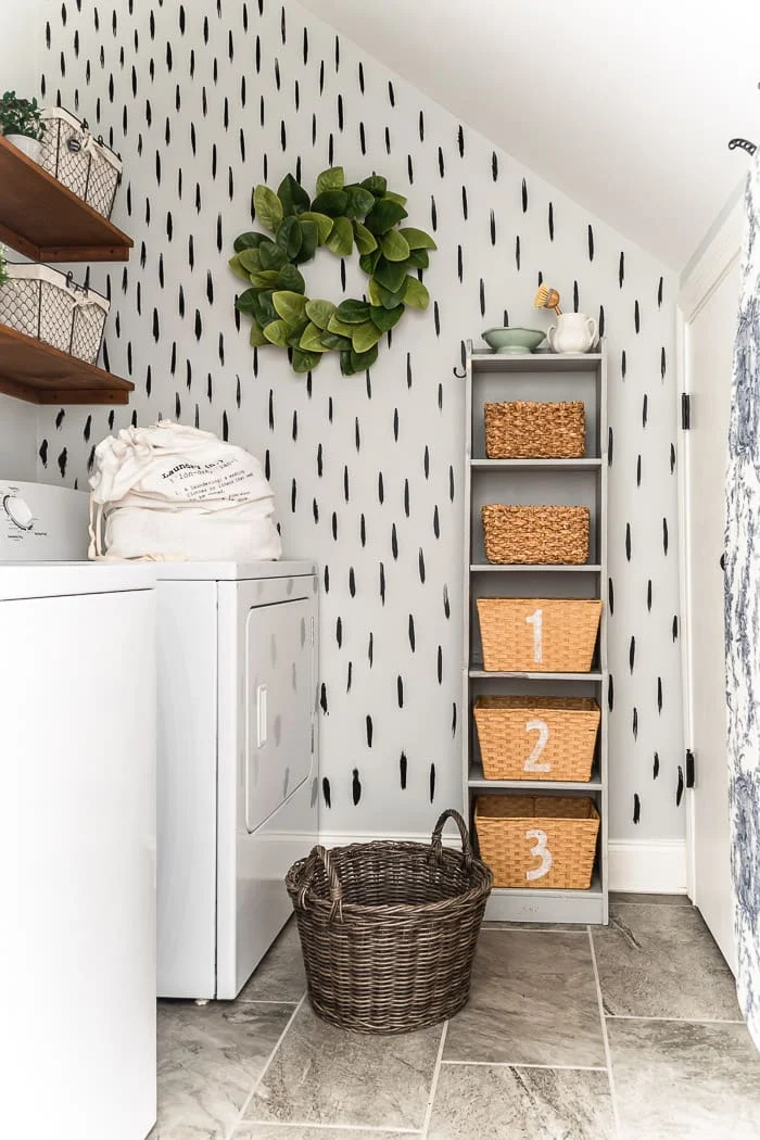laundry room DIY shelves, brush stroke wall, vintage storage tower with numbered baskets