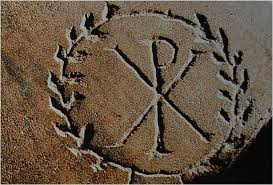 Early Christian symbol Chi-Ro carved into the wall in san Callisto catacombs Rome, Italy