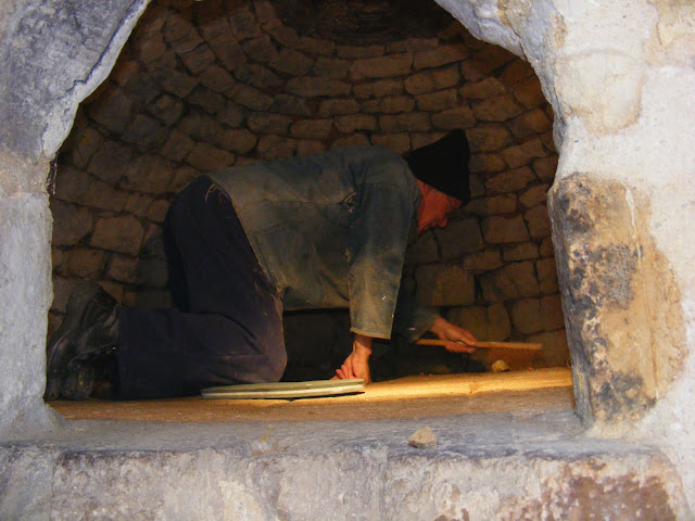 Large bread oven being swept out, Indre et Loire, France. Photo by Loire Valley Time Travel.