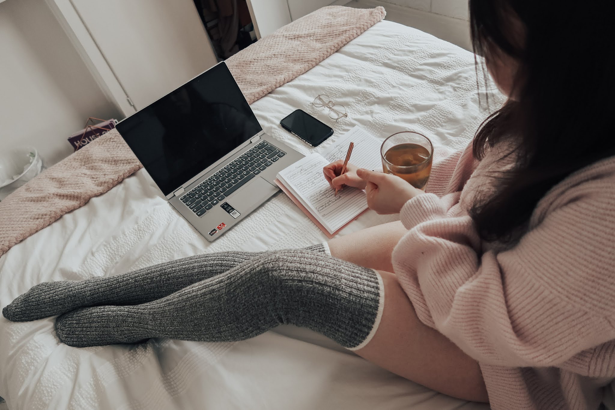 A woman writing in a notebook