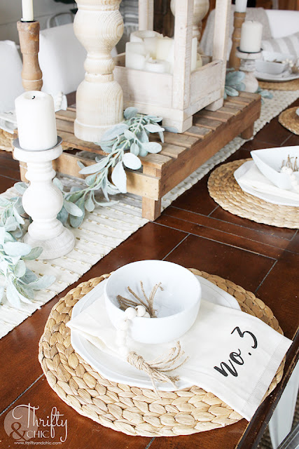 place setting on wood table with place setting