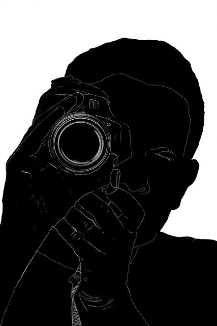 silhouette of a man with camera