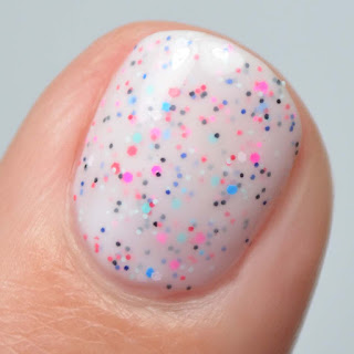 white crelly nail polish with bright glitter