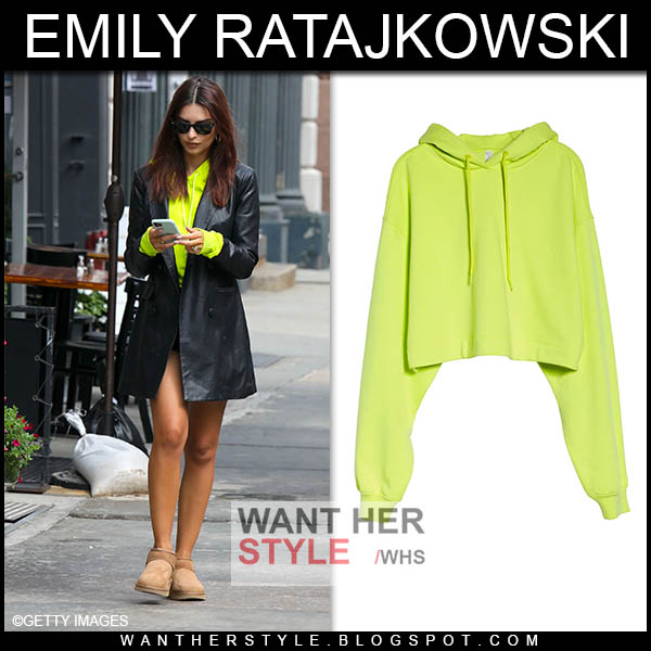 Emily Ratajkowski wearing neon cropped hoodie from Alo Yoga.