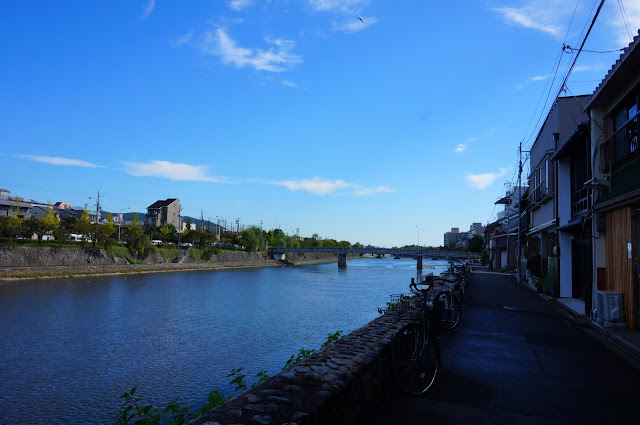 Kamogawa (Kamo River) with a view of Japanese houses on the right