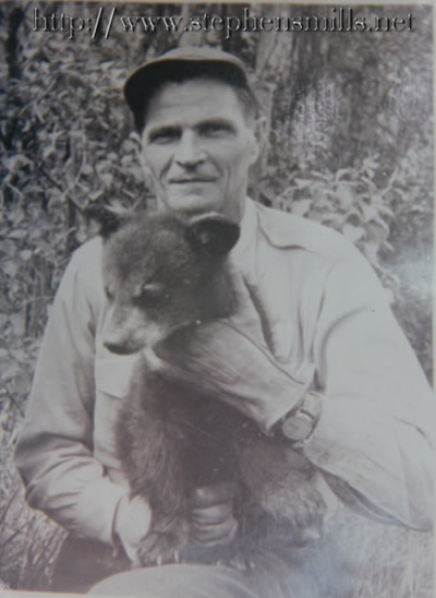 Photo of Alfred Jackson with bear cub