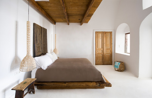 chic bedroom of raw wood and natural fiber