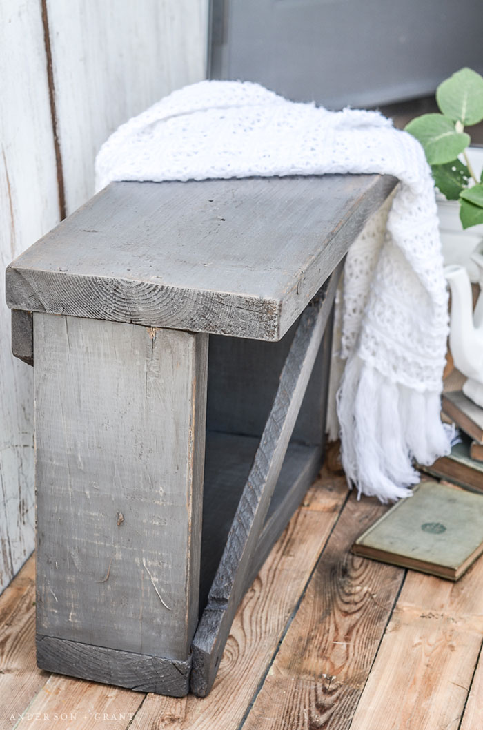 This small bench was constructed out of old boards and given lots of vintage charm with paint, wax, and a secret distressing technique.  #DIY #furnituremakeover #bench #farmhouse #farmhouseDIY