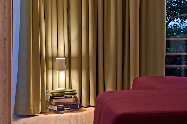 Brown Wooden Floor and Dark Yellow Colored Curtains