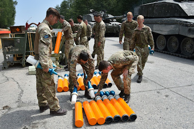 Troopers from the Queens Royal Hussars load their Challenger 2 tanks during the Strong Europe Tank Challenge at Grafenwoehr in Germany on the 7th of June 2018