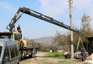 The crane had a very long unloading arm