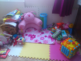 nice clean and tidy play mat area with rabbit baby nest