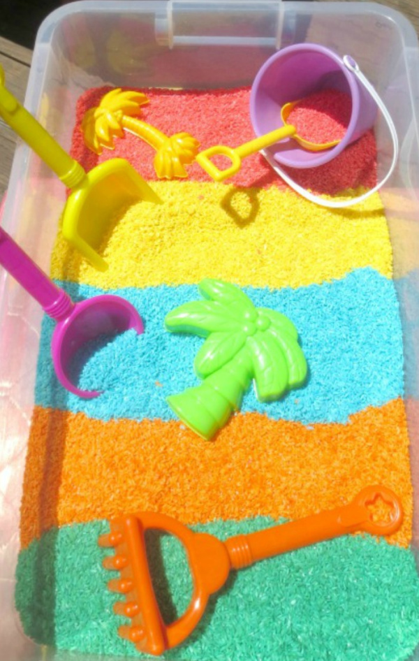 Make play rice for kids using Kool-aid!  Easy recipe and less messy than sand. #koolaiddyedrice #riceforkids #howtodyerice #ricerecipes #growingajeweledrose #activitiesforkids