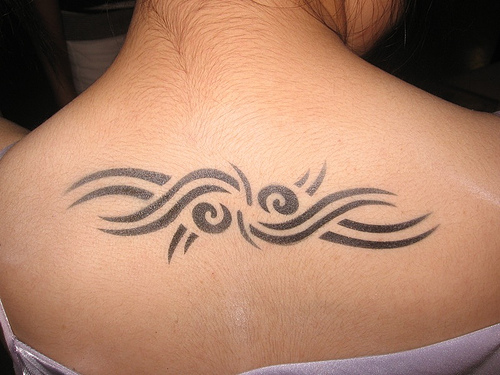 Excellent Tribal Tattoo On Upper Back For Male