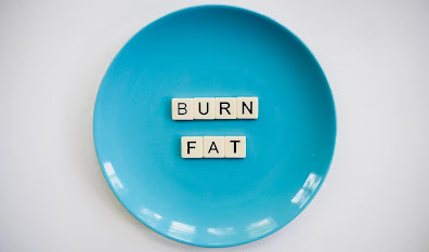Blue plate with scrabble cubes that read burn fat