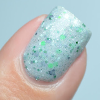 gray nail polish with green glitter