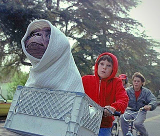 E.T. in a crate with Elliot on a bike