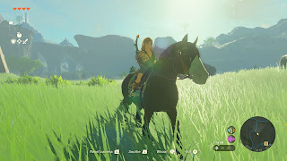 Link on a horse on the field near Fort Hateno